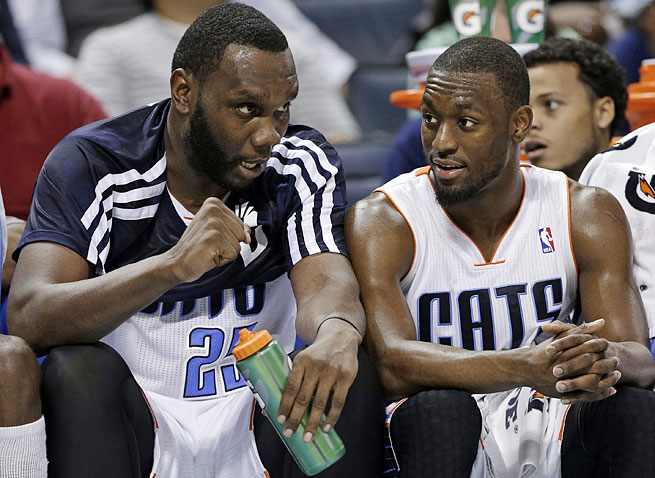Guard Kemba Walker (right) recruited Al Jefferson to Charlotte to help guide the young Bobcats.